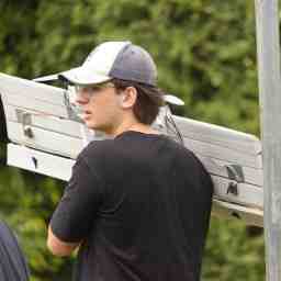 Kaden holding the plane on his shoulder
