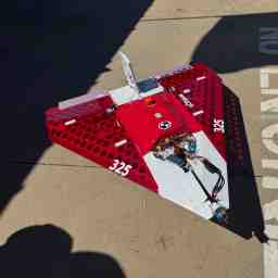 The aircraft waiting on some concrete