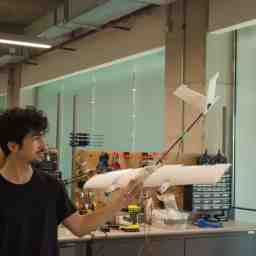 holding an early version of Starling in the workshop
