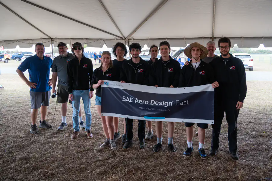 Holding the SAE Aero Banner at the competition awards ceremony